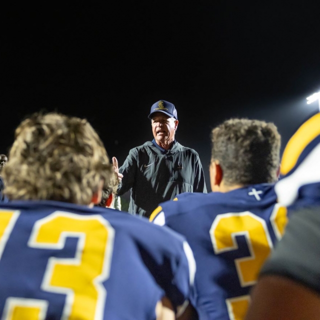 Coach Rick Curtis commends the team on their league championship