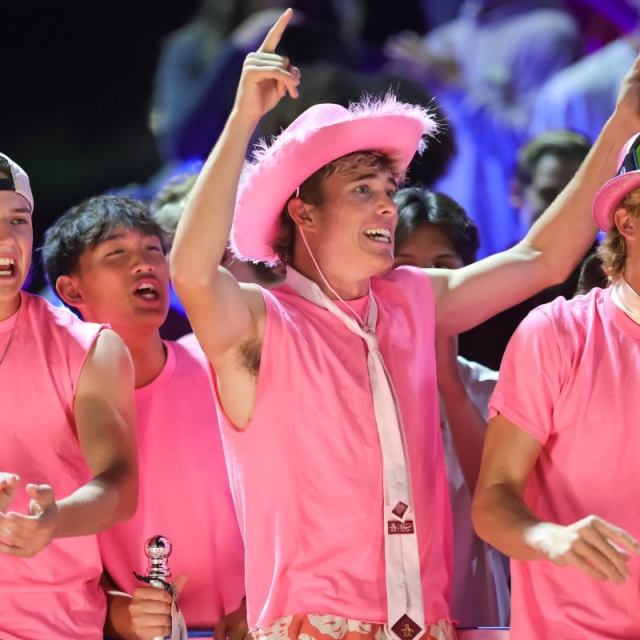 Crean Lutheran’s Blue Zone celebrates a touchdown on Pink Out Senior Night