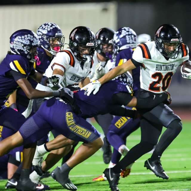 Huntington Beach’s Nathan Sammartano fights for a first down