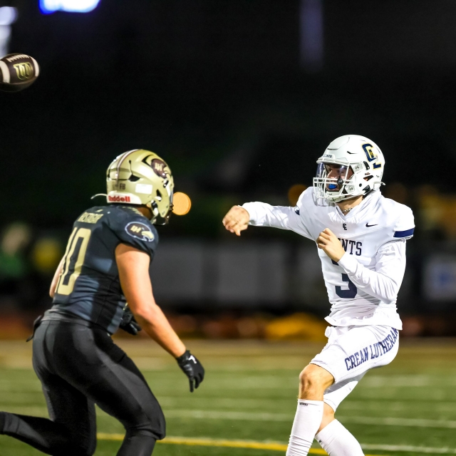 Saint’s QB Caden Jones finds an open receiver as Laguna Hill’s Aaron Rastagar pursues