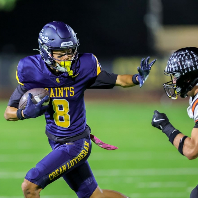 Saints receiver Taiga Takada evades Huntington Beach’s Maxx Hopkins
