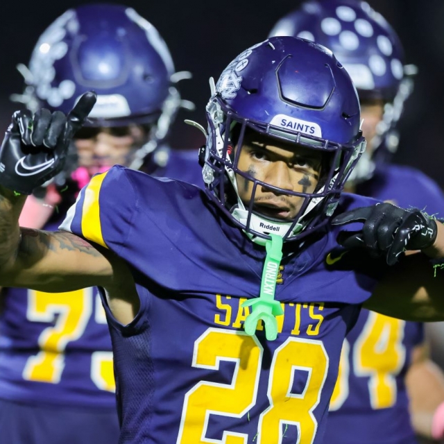 Saints running back Caleb Bey celebrates