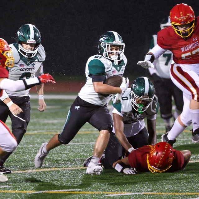 Buena Park wide receiver Vincent Pulido evades defenders