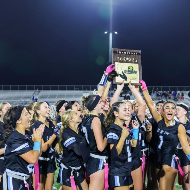 Corona Del Mar players present the CIF title plaque to fans