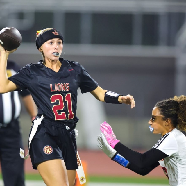 JSerra QB Ava Van Heerde spots an open receiver as Olu’s Izzy Thomas pursues