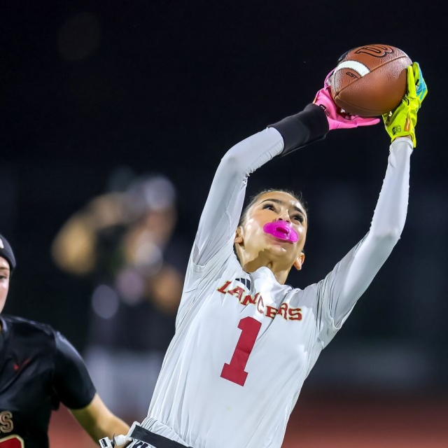 Orange Lutheran receiver Ava Harrison leaps for the ball