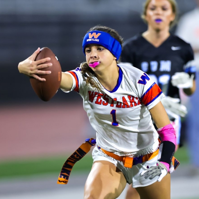 Westlake receiver Olivia Elsokary reaches for the goal line