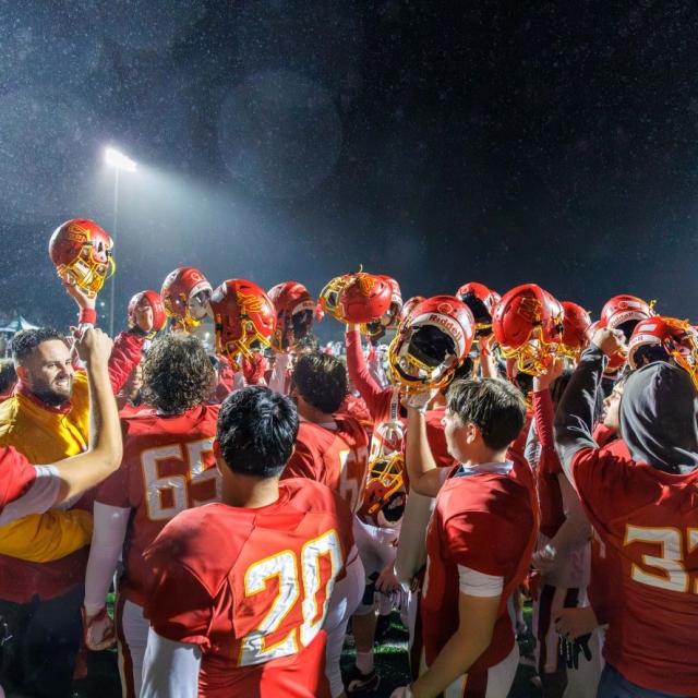 Woodbridge players and coaches celebrate post game