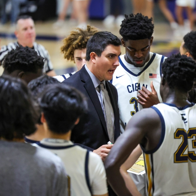 Crean Lutheran head coach Austin Loeb talks to the team during a Foothill timeout