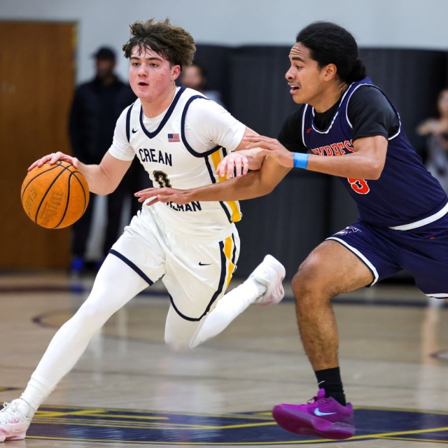 Crean Lutheran’s Caden Jones drives against Cypress’s Tyrus Allen