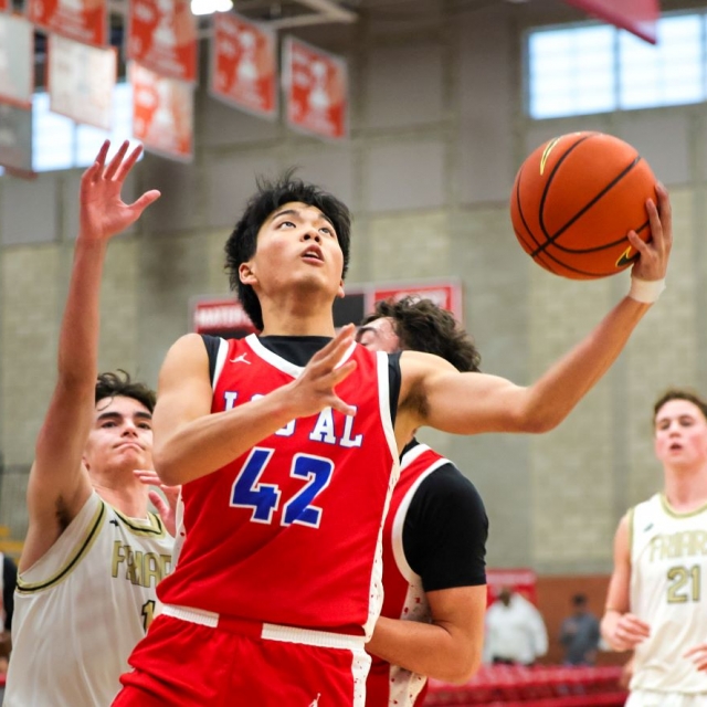 Los Alamitos’s Ethan Lee drives to the basket
