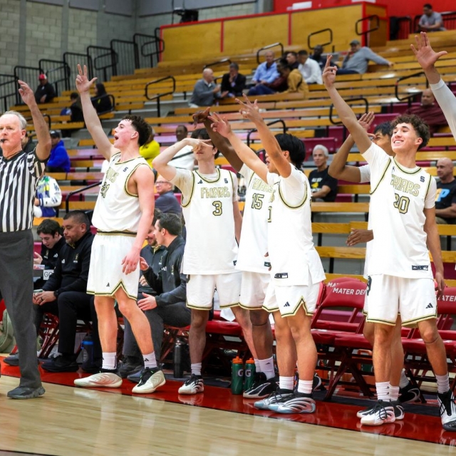 Servite bench celebrates a big play