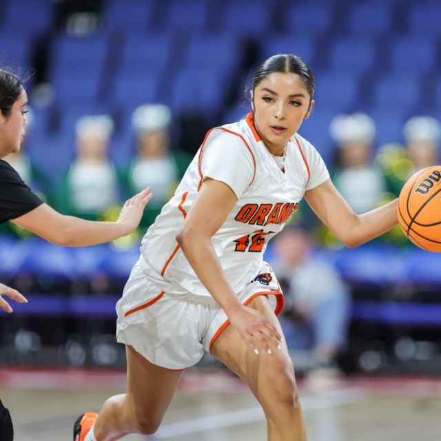 Aubrey Macedo of Orange drives up court as Schurr presses