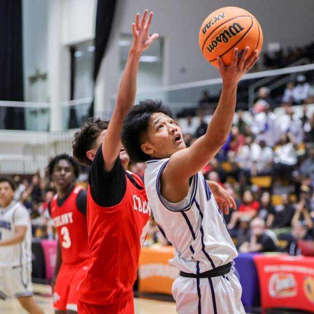 Carter Peckson of Trabuco Hills drives for a layup