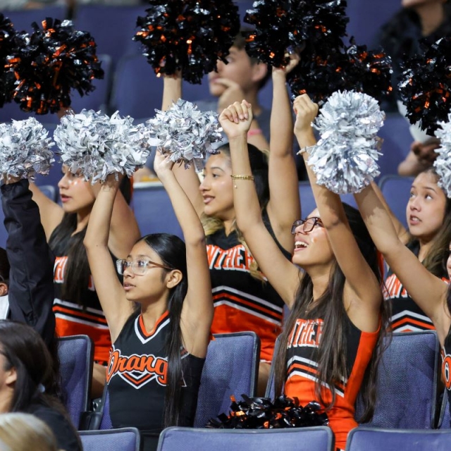 Orange cheerleaders cheer a big play