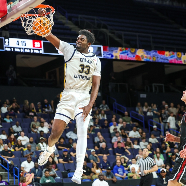 Crean Lutheran’s Chadrack Mpoyi dunks the ball in the first half