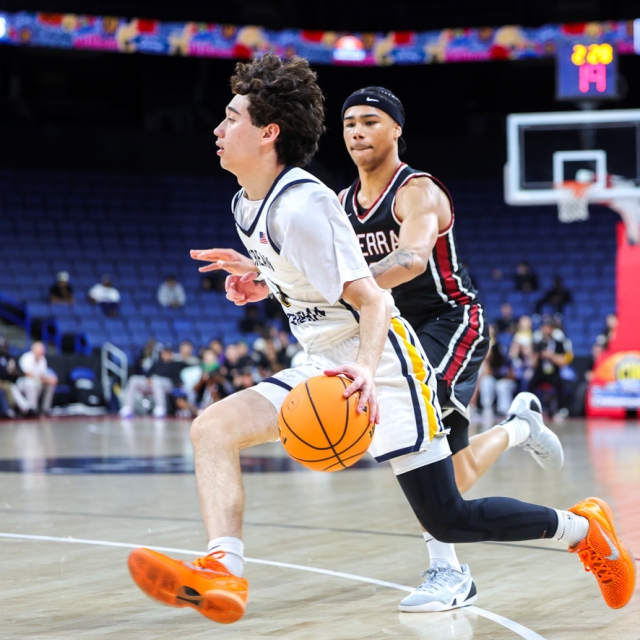 Hunter Caplan of Crean Lutheran drives the baseline as JSerra’s Earl Bryson pursues