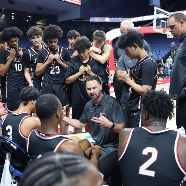 JSerra Catholic head coach Keith Wilkinson strategizes with his players