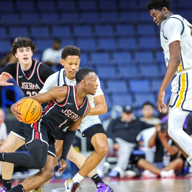 JSerra’s Jaden Bailes attempts to evade Crean Lutheran’s Bryce Coleman and Chadrack Mpoyi