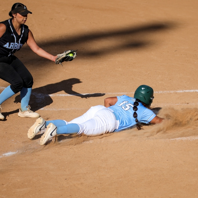 Andrea Torres slides into homeplate to score a run for Irvine