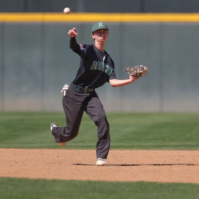Carson Lamb of Rancho Alamitos fields the ball