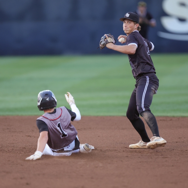 Lincoln Adams of Laguna Beach attempts a double play
