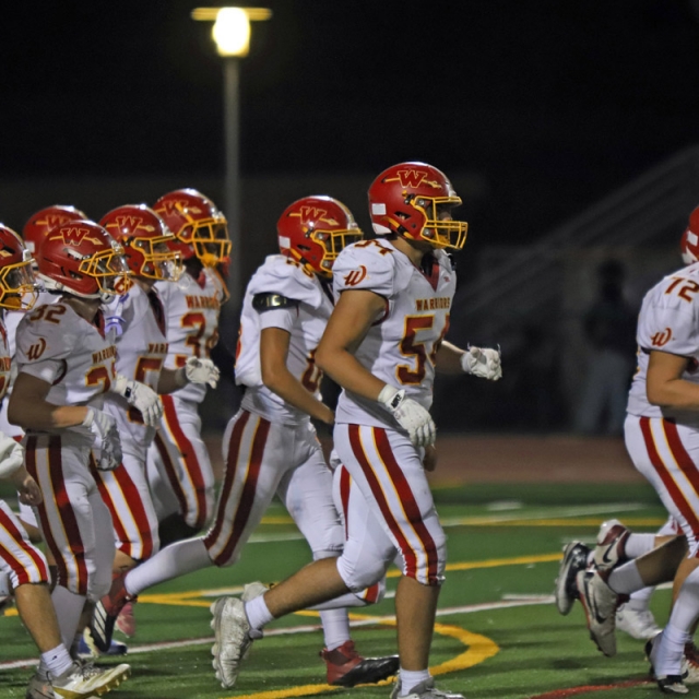 Woodbridge players enter the field of play after the halftime break.