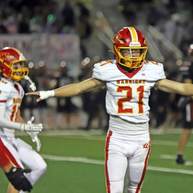 Woodbridge safety Adam Howell celebrates after making a defensive play.